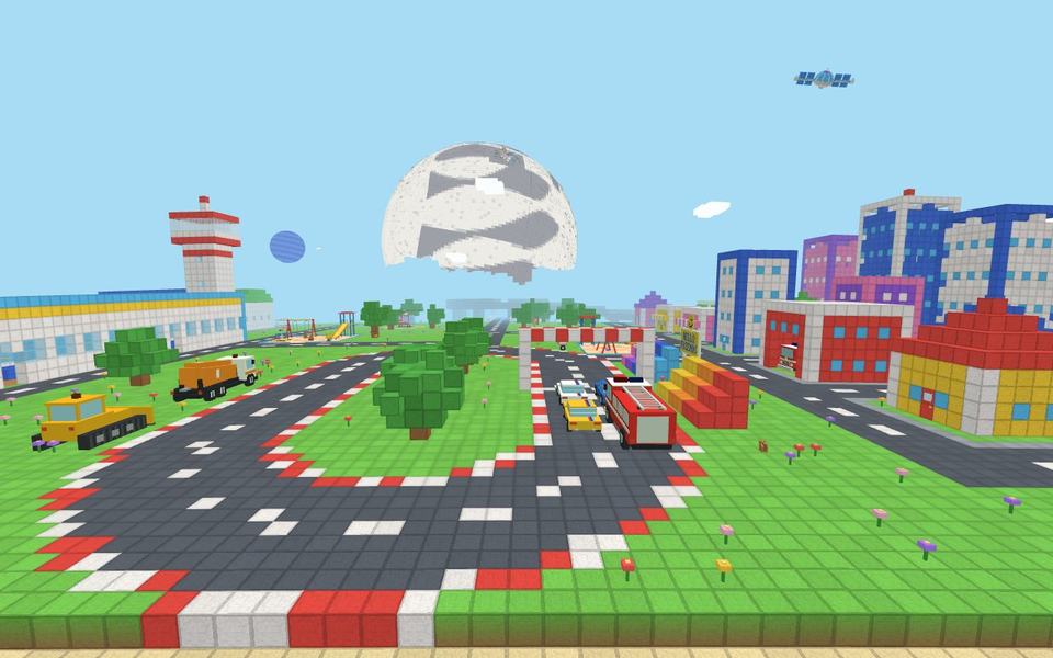 A race track with a fire truck, a bulldozer and cars, beside a colorful town